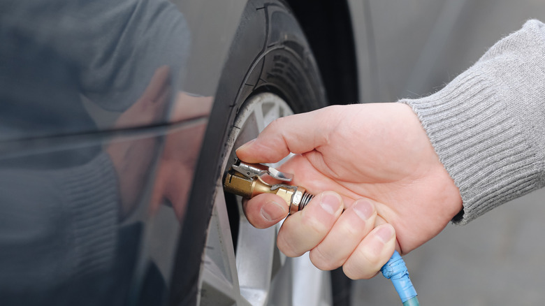 Checking tire pressure on vehicle