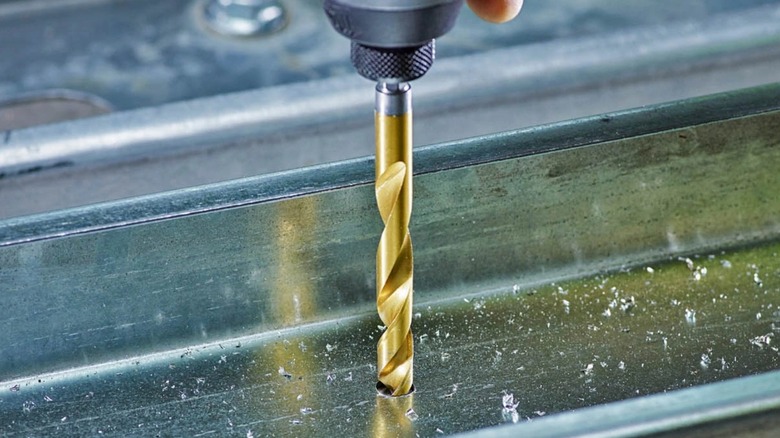 Milwaukee drill bit driving into metal