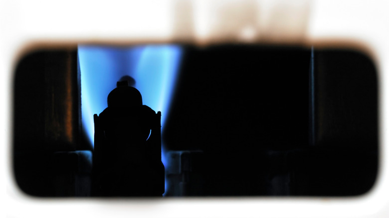 Close up of pilot light from gas appliance.