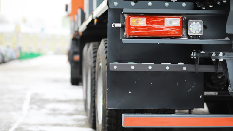 Close-Up of Heavy-Duty Truck Rear with Detailed Tail Lights and Mudflaps