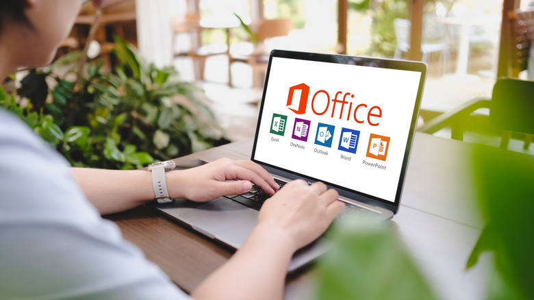 Person using Microsoft office on a laptop