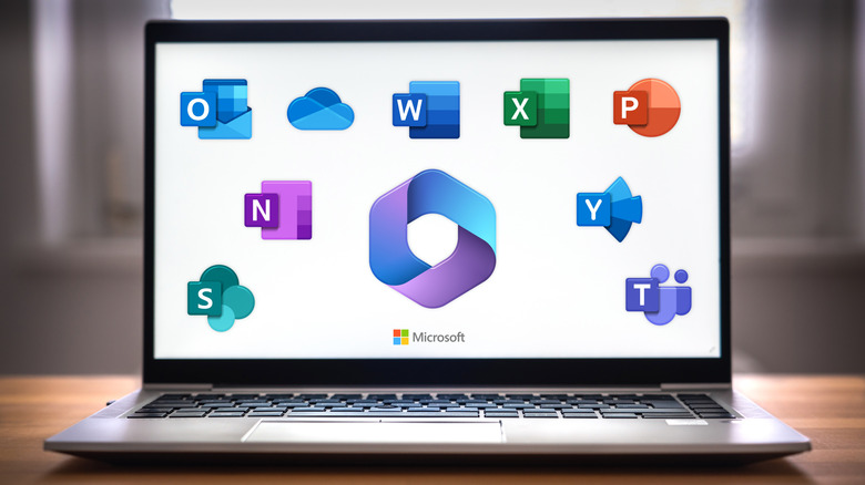 Laptop with various Microsoft Office apps on its display
