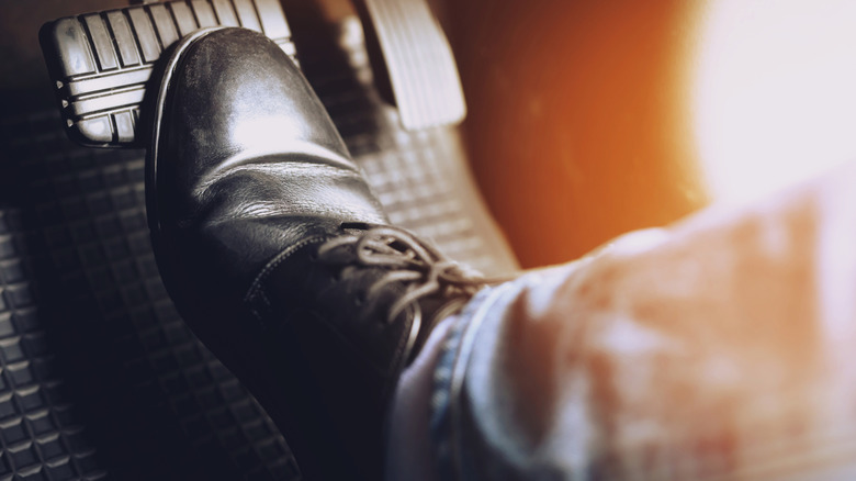 Boot pushing down on brake pedal