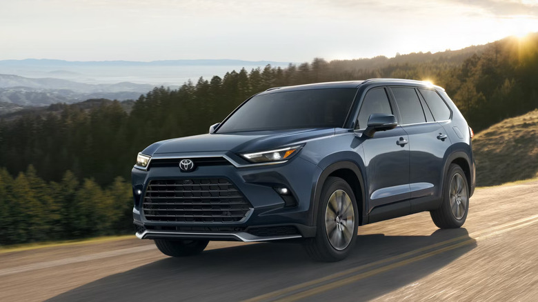 Toyota Grand Highlander blue driving