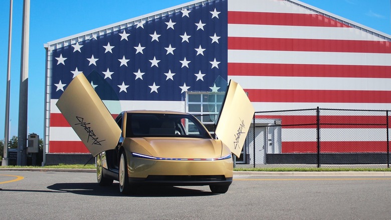 Tesla Cybercab in front of America-themed building