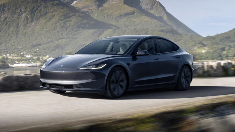 Grey Tesla Model 3 on highway