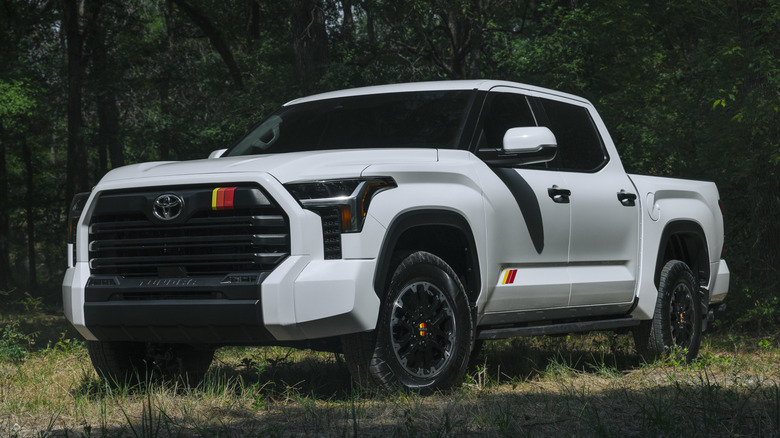 Front 3/4 view of 2025 Toyota Tundra in forest