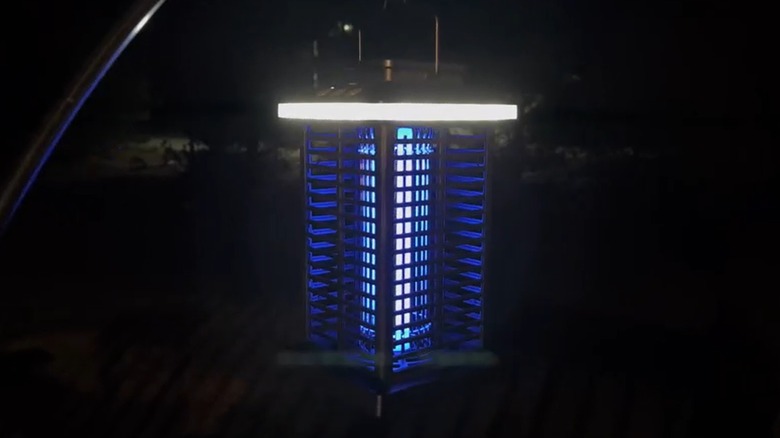 A bug zapper turned on at night.