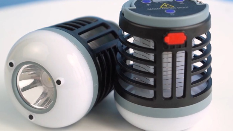 Two bug zappers on a table.