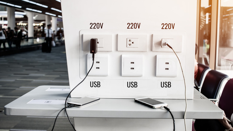 Wall outlets with charging phones at airport