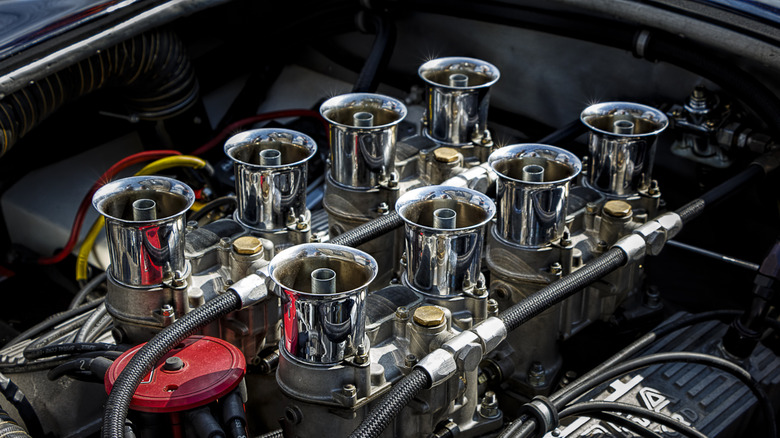 Close-up of 427 cubic inch V8 displaying fuel system of four two-barrel carburetors