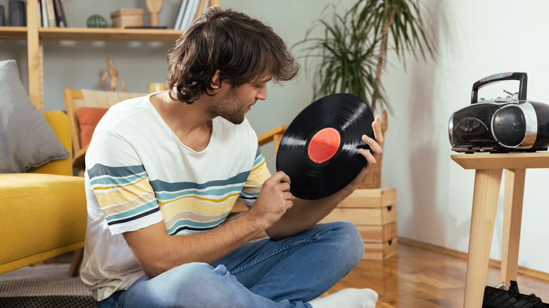 man with vinyl and boombox