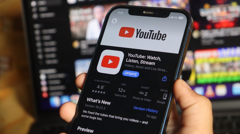 person watching youtube on phone