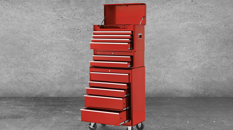 A tool chest tower with various drawers opened.
