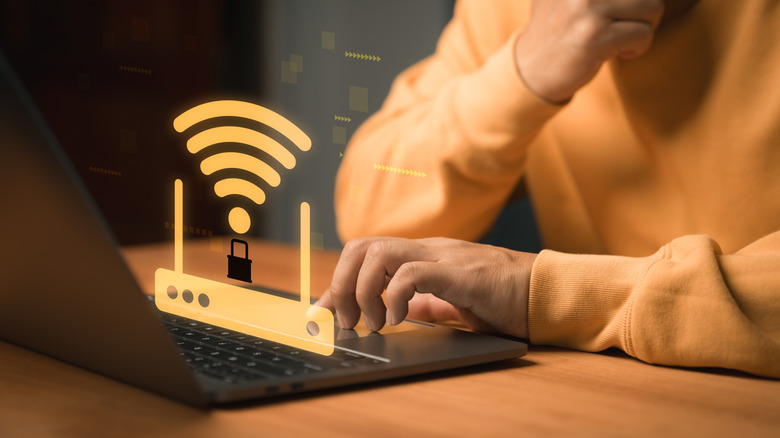 Wi-Fi router with a lock symbol above a laptop