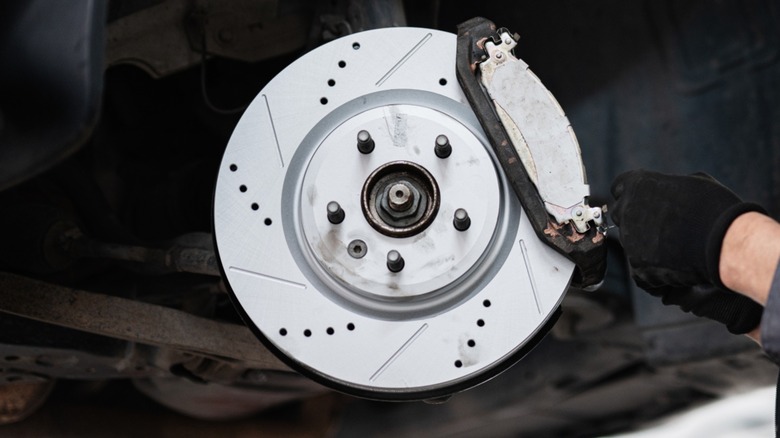 A vehicle's disc brake with the brake caliper removed.