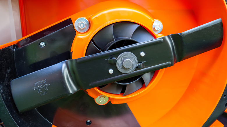 Close-up of the underside of a new lawn mower deck