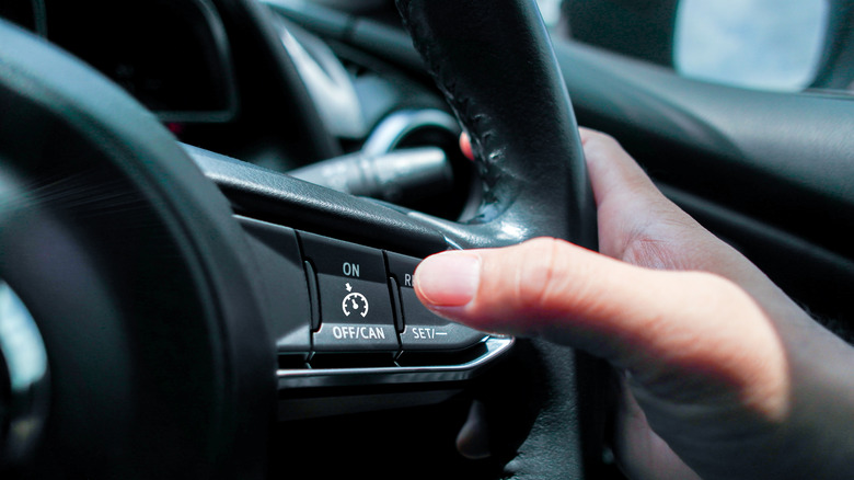 Automotive cruise control system on the steering wheel in a car