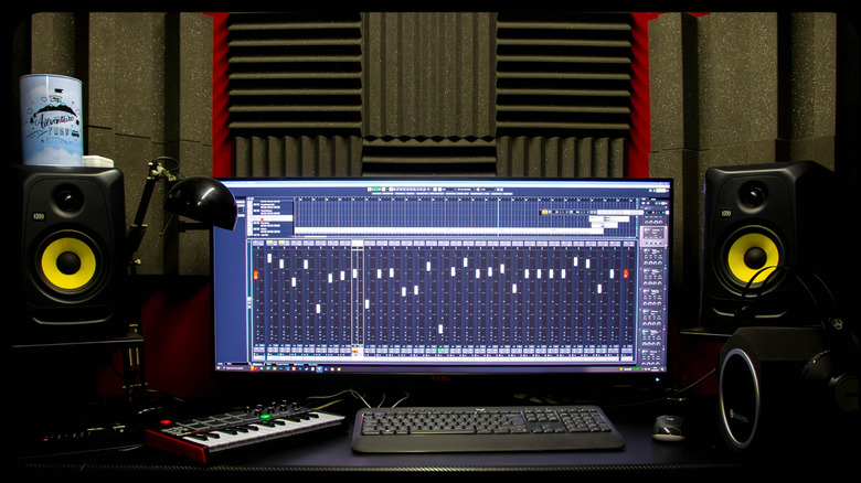 Home recording studio with KRK monitors, keyboards, and audio workstation
