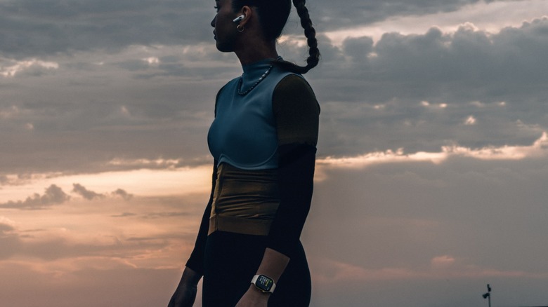 Person standing and wearing new Apple Watch.