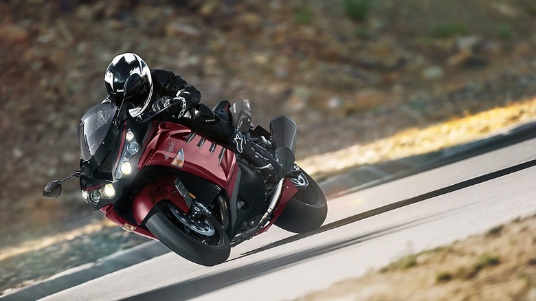 2025 Kawasaki Ninja ZX-14R traveling at speed in right-turn, front-left view