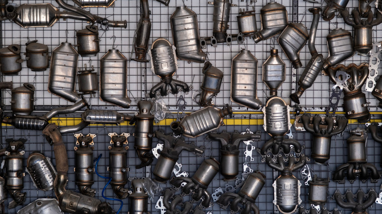 Various automotive exhaust components hanging on a wall