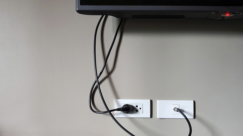 TV plugged into wall outlet in stanby mode