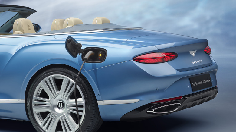A blue Bentley Continental GTC hybrid plugged in.