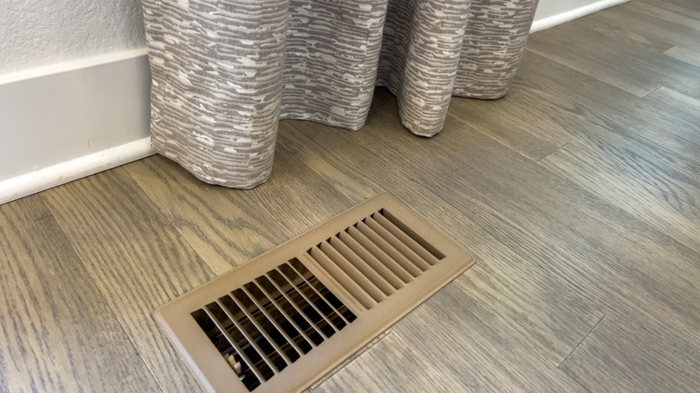 Floor vent register near wall