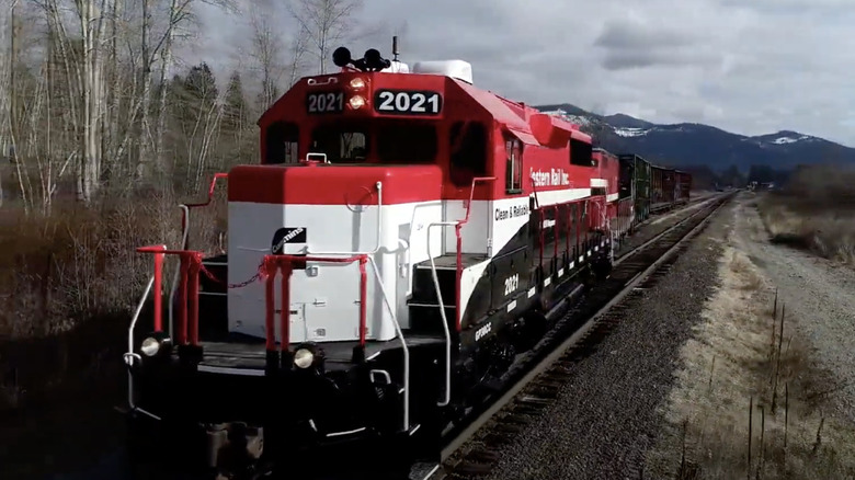 Train using Cummins engine riding over railway tracks