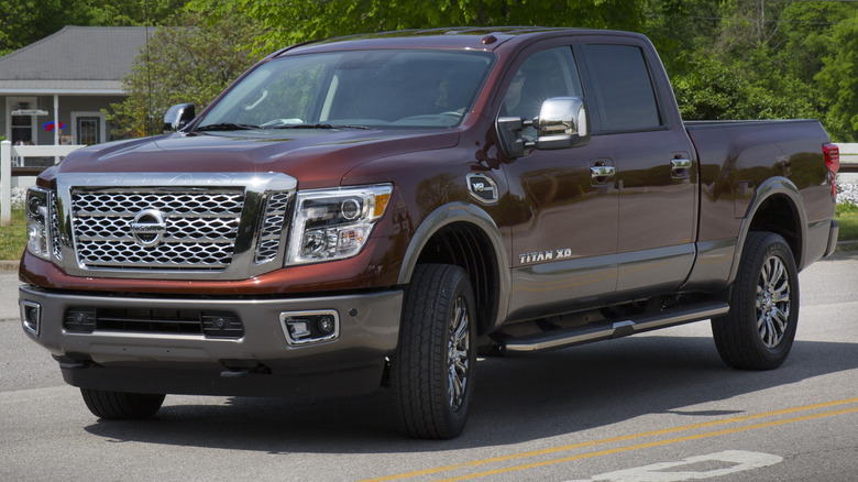 Maroon 2016 Nissan Titan XD parked on a road