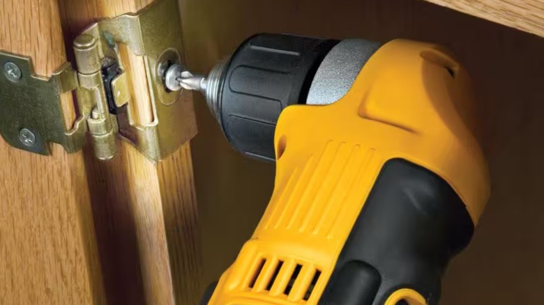 DeWalt Right Angle Drill fastening a hinge screw