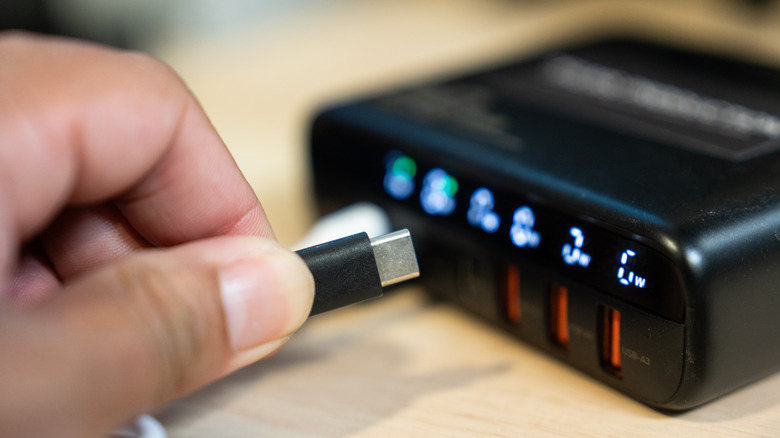 USB-C cable being inserted into a docking charger