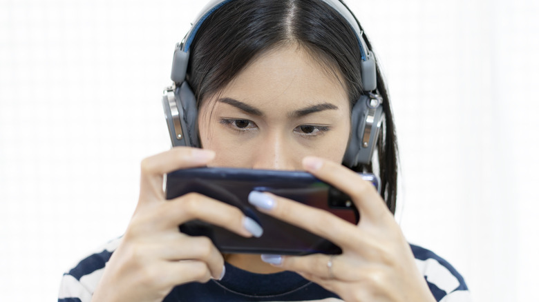 A person playing a game on their phone