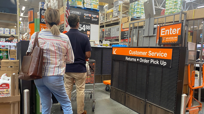 Customers waiting in line at a Home Depot
