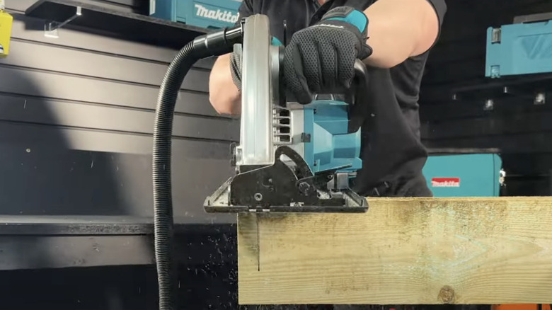 Front-facing view of Makita 40V Max XGT Cordless 16-inch Circular Saw in action