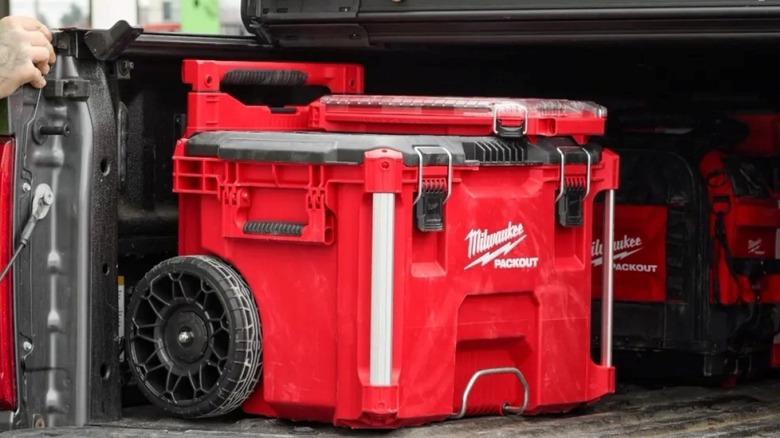 The Milwaukee Packout Rolling Tool Box under a truck tonneau cover after the low-profile handle upgrade.
