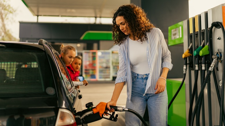 woman filling gas tank