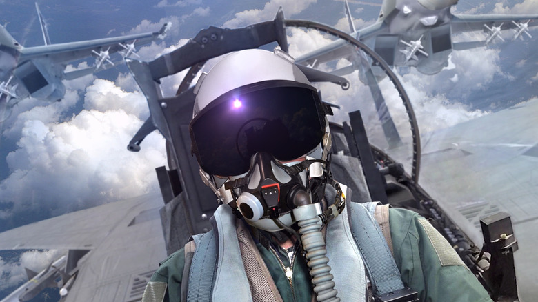 A fighter pilot in a jet cockpit.