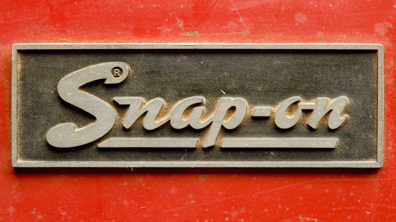 Close-up of an old metal Snap-on logo