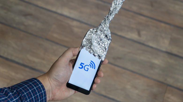 A phone wrapped in aluminum foil.