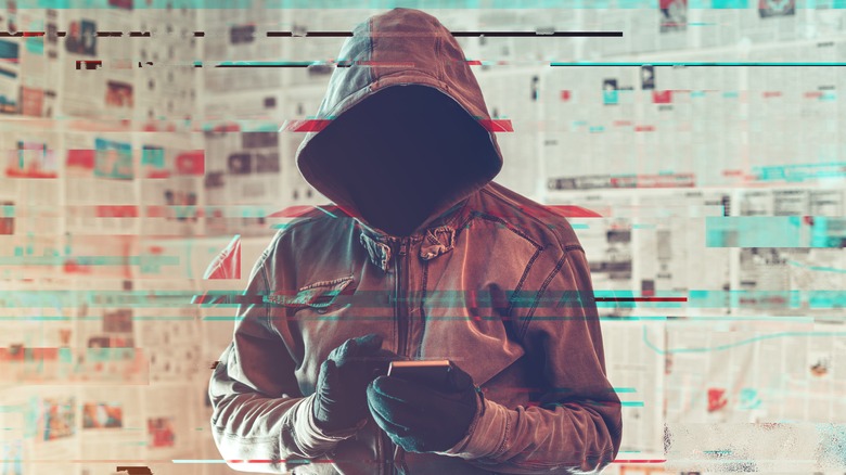 hacker using a smartphone
