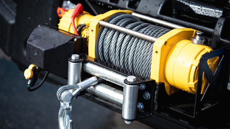 Close-up shot of a yellow winch of an off-road vehicle