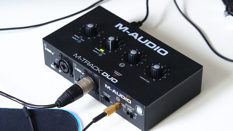 Sound card on table with cables plugged in