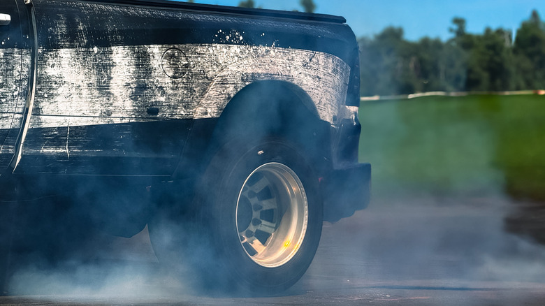 Close-up of rear tire of a diesel Ram truck during a burnout