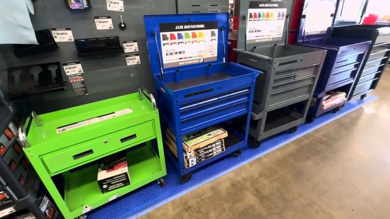A selection of colorful tool carts in a store