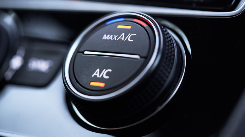 A car's air conditioning dial turned on