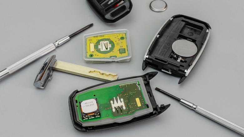 An opened car key fob.