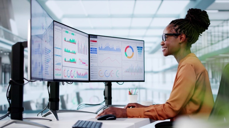 Person using a multi-monitor setup
