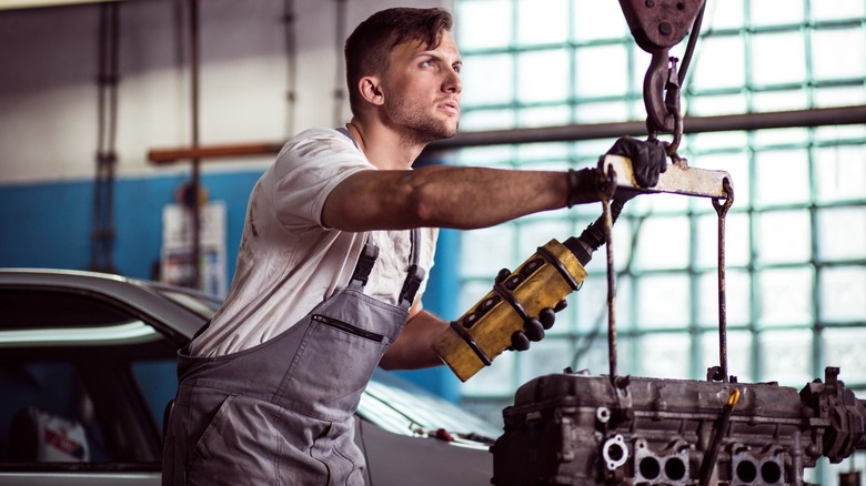 person using an engine hoist